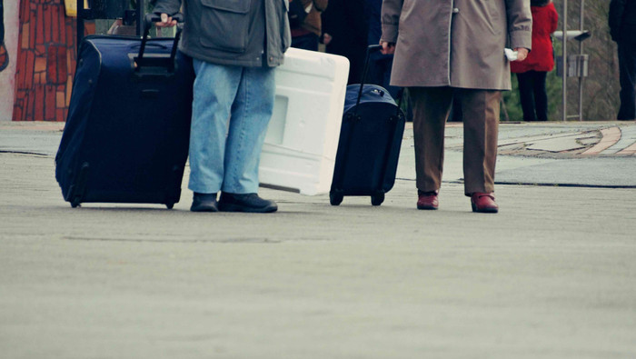 Low section people walking with luggage city