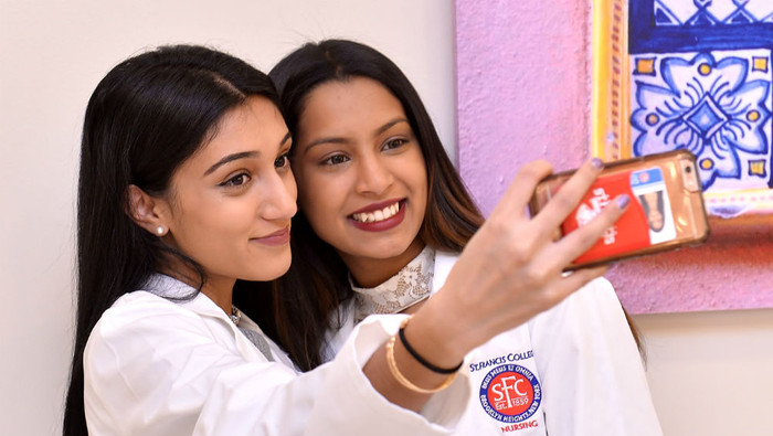 Nursing students taking pictures