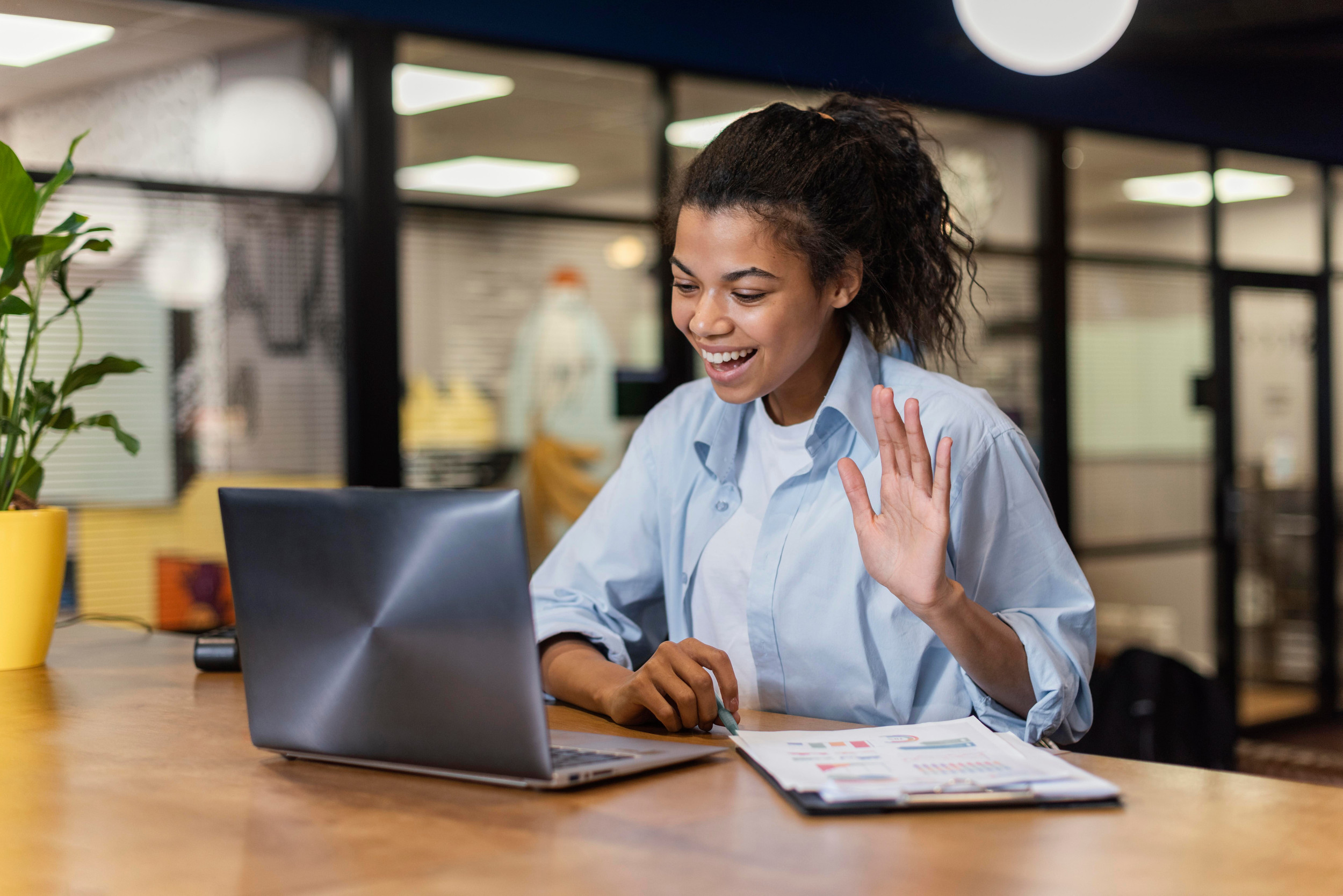 Smiley student having video call office