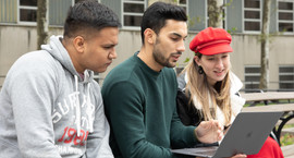 Students Outside Exploring on Laptop